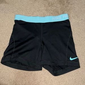 Light blue Nike Pros